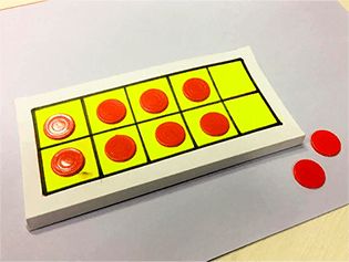 Learn addition of circular magnets on ten frame